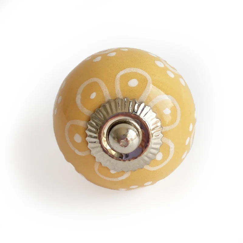 Bouton jaune avec motifs blancs