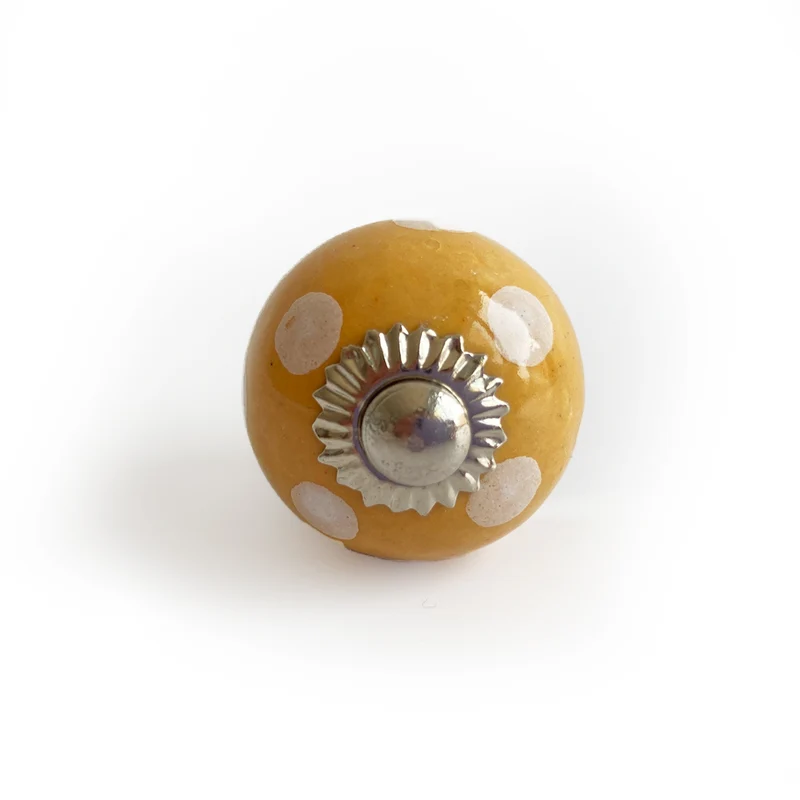Bouton rond jaune à pois blancs